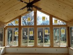 the inside of a building with windows and signs on it's walls that say no tress