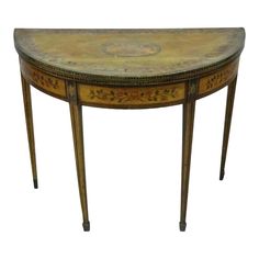 an oval shaped table with floral designs on it