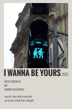 a traffic light with the words i wanna be yours 2013 written on it and an image of two people holding hands