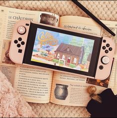 an open book with a video game on it