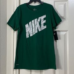 Nike Woman’s T-Shirt Size - M Style - Cu2828-341 Color - George Green *** Brand New New To Poshmark? Use Code @Iceskatingmom To Get $10 Off Your First Purchase!!! Nike Green Graphic Print T-shirt, Nike Green Sports T-shirt, Nike Green T-shirt With Graphic Print, Green Sports Tops With Logo Print, Nike Green Tops With Graphic Print, Green Sporty Shirt With Logo Print, Green Sporty Shirt With Graphic Print, Sporty Green Shirt With Logo Print, Green Short Sleeve Shirt With Logo Print