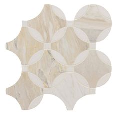 a white and beige mosaic tile with circles on the bottom, in an irregular pattern