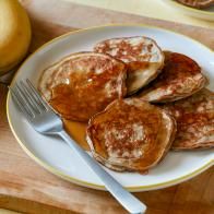 pancakes on a plate with syrup and butter