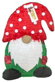 a close up of a stuffed animal wearing a red mushroom hat