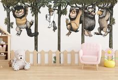 there are three monkeys hanging on the trees wall decals in this children's room