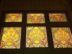 a stained glass window in the corner of a room