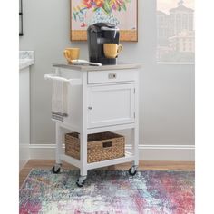 a small white cart with a coffee maker on top and a basket under the cart