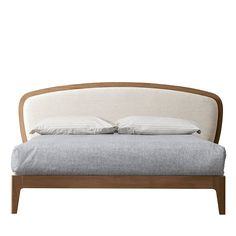 a bed with two pillows on top of it