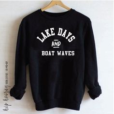 a black sweatshirt that says lake days and boat waves