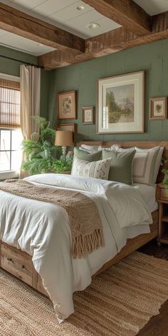 a bed sitting in a bedroom next to a window filled with green plants and pillows