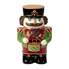 a ceramic nutcracker with a hat and beard