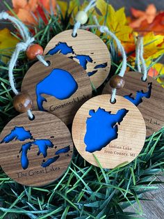 four wooden ornament shaped like the great lakes