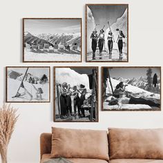 four black and white pictures hanging on the wall above a couch in a living room