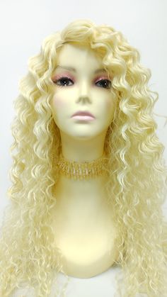 "Long and layered wet look curls with a fixed side skin part. Inside cap adjustable elastic straps for a secure fit. Color: Light Blonde (613) Style: 26 inches, Long and Curly Circumference: Default at 21\" with adjustable cap (max 22\") Materials: Synthetic Wig Fiber All sales are final. Please read all store policies before purchasing." Long Blonde Layered Wigs, 613 Long Curly Wig, 40 Inch Blonde Wig, Long Blonde Lace Wig, Blonde Drag Wig, Back Combing, Stocking Cap, Wet Look, Light Blonde