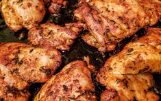 some chicken is cooking in a pan on the stove top and it looks like they have been cooked