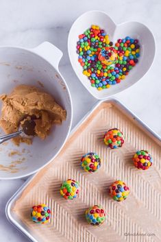 there are several desserts in bowls on the table