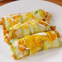 zucchini enchiladas on a white plate with the title overlay