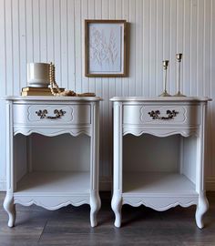 two white nightstands sitting next to each other