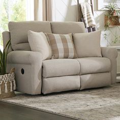 a living room scene with the text lay flat reclining loveseat on it