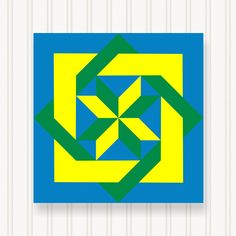 a blue, yellow and green square with an interlocked design in the middle