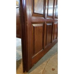 a close up of a wooden door in a room