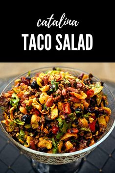 a bowl filled with taco salad on top of a table