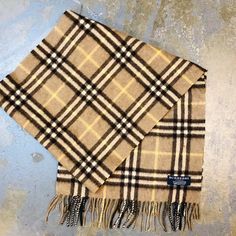 100% Pure Scotish Cashmere. Made In Uk. 2" Fringe At Ends. Updated Burberry Modern Plaid. Excellent Pre-Owned Condition Measures 52" X 12" Retail $490 Winter Scarf Burberry, Burberry Plaid Poncho, Burberry Vintage Scarf, Modern Plaid, Luxury Plaid Wool Scarves, Burberry Scarves & Shawls, Beige Plaid, Burberry Accessories, Cashmere Scarf