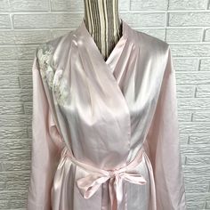 Vintage light pink satin robe featuring a sheer embroidered floral design by Vandemere. Size Large. Closure: Tie, Button, BeltMaterial: 100% Polyester Measurements Bust: 46”+Shoulder to Hem Length: 37”Sleeve Length: 22”S21 Pink Satin Robe, Cream Silk, Vintage Velvet, Pink Satin, Vintage Lighting, Vanity Fair, Silk Satin, Vintage Pink, Floral Embroidery