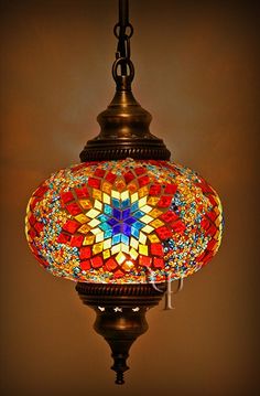 a colorful light hanging from a ceiling fixture