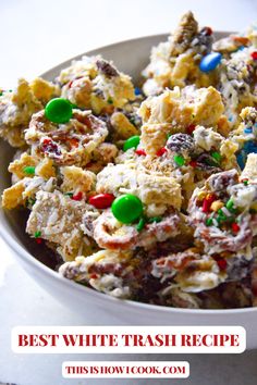 a white bowl filled with cookies and candy