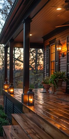 two lit candles are sitting on the porch