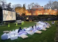 an outdoor movie is set up on the lawn