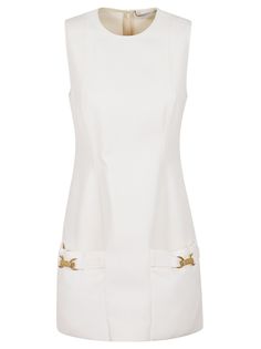 This elegant mini dress by Stella McCartney features a round neck and structured silhouette. Front pockets with golden buckle details enhance its style, made from a luxurious wool scuba blend for comfort. Perfect for gatherings or outings.

- Sleeveless design  
- Round neck  
- Structured silhouette  
- Front pockets with golden buckle details  
- Wool scuba blend material Elegant Mini Dress, Vegan Clothing, Sleeveless Mini Dress, Chic Woman, White Mini Dress, Dress Making, Stella Mccartney, Dress To Impress, Sleeveless Dress