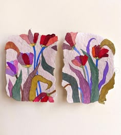 two pieces of paper with flowers painted on them