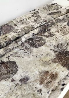 the bed is covered with an old, dirty sheet that has been turned into a comforter