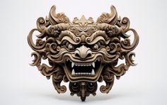 an intricately carved mask is displayed on a white background, with the mouth open and it's teeth wide open