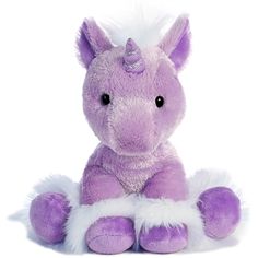 a purple and white stuffed animal sitting on the ground