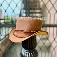 Introducing the Brown Leather Top Hat - Handcrafted Pale Rider, a stunning, handcrafted accessory featuring a burn-style band that adds a rugged and gothic edge to the classic Steampunk Top Hat. This hat is perfect for men who appreciate bold fashion statements and makes an ideal gift for him. Whether you're dressing up for a special occasion, steampunk event, or simply want to showcase your unique style, this gothic-inspired top hat is sure to impress. Product Description: Crafted from premium Classic Steampunk, Leather Top Hat, Pale Rider, Steampunk Top, Mode Steampunk, Brown Leather Top, Steampunk Top Hat, Gothic Tops, Steampunk Hat