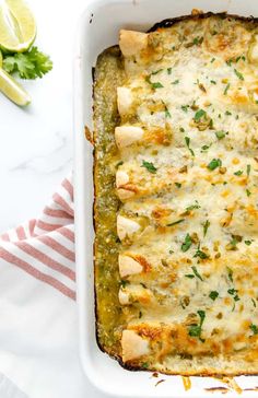 a casserole dish filled with chicken and cheese