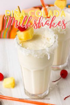 two glasses filled with pineapple milkshakes on top of a table