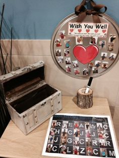 a wooden table topped with an old trunk and a sign that says wish you well