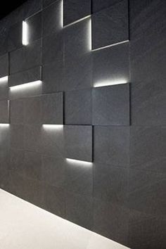 a black wall with some lights on it