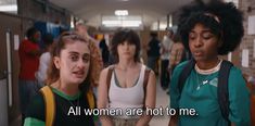 three women standing in a hallway with the words all women are hot to me