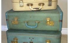 three suitcases stacked on top of each other