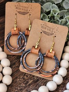 Wood and Faux Leather Earrings: Make a statement with these beautiful boho earrings for women. These wooden dangle earrings are a perfect gift for your best friend or a wonderful birthday gift for your girlfriend. The colorful wooden circles come in an array of fun colors and paired with a light brown faux leather and gold colored stainless steel hardware.  Size:  *Pendant Size: 1.5 inches *Dangle Size: 2.5 Inches Material:  *Hardware: Gold Colored Stainless steel that is great for sensitive ear Cheap Bohemian Leather Earrings, Wood And Leather Earrings, Wood Jewelry Diy, Earring And Necklace Set, Wood Dangle Earrings, Boho Earring, Earthy Jewelry, Laser Cut Jewelry, Earrings Wood