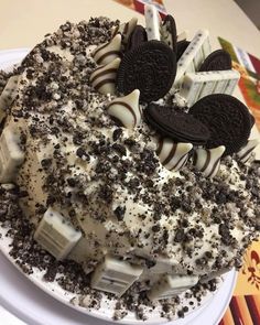 an oreo cookies and cream cake on a plate