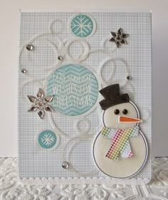 a card with a snowman on the front and an ornament in the back