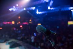 a microphone in front of an audience at a concert