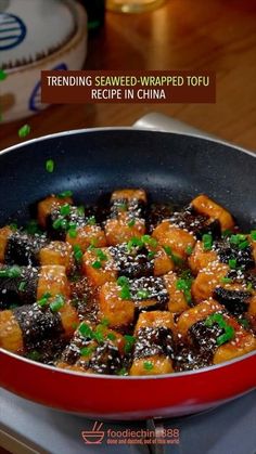 a pan filled with food sitting on top of a stove