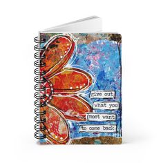 a spiral notebook with the words live out what you want to come back written on it